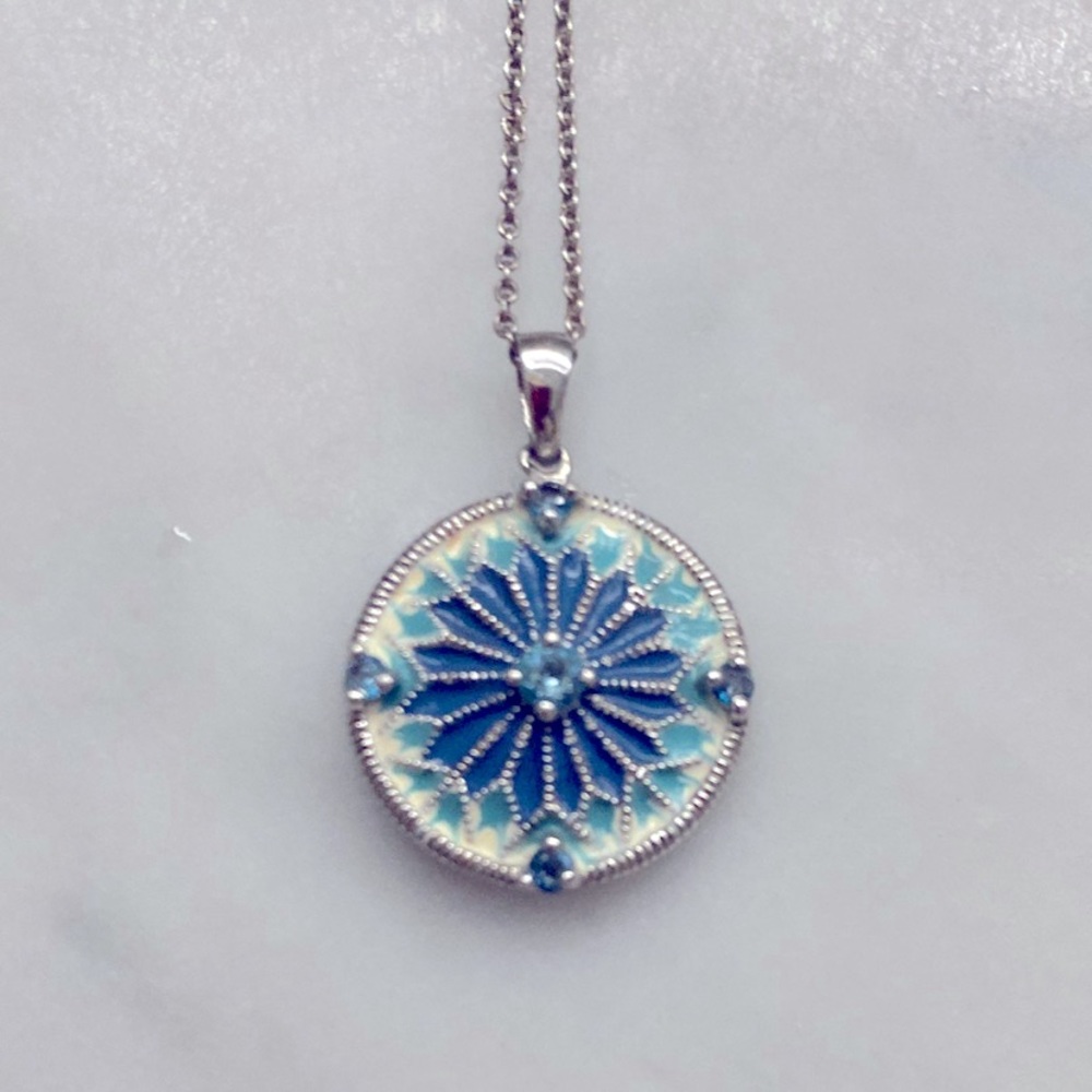 Tiffany & Co sterling silver chain & silver dollar blue topaz sterling pendant.